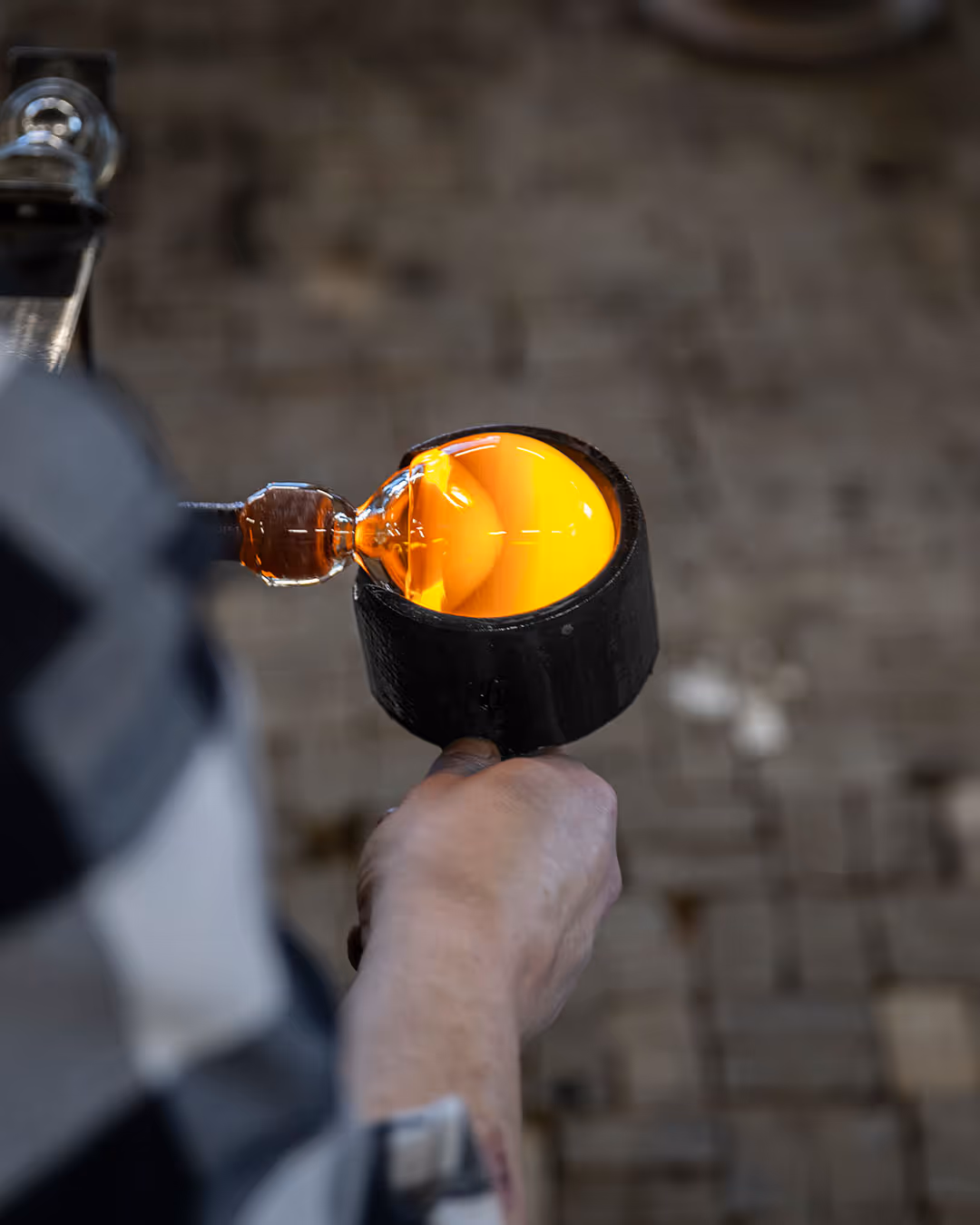Artist shaping glass