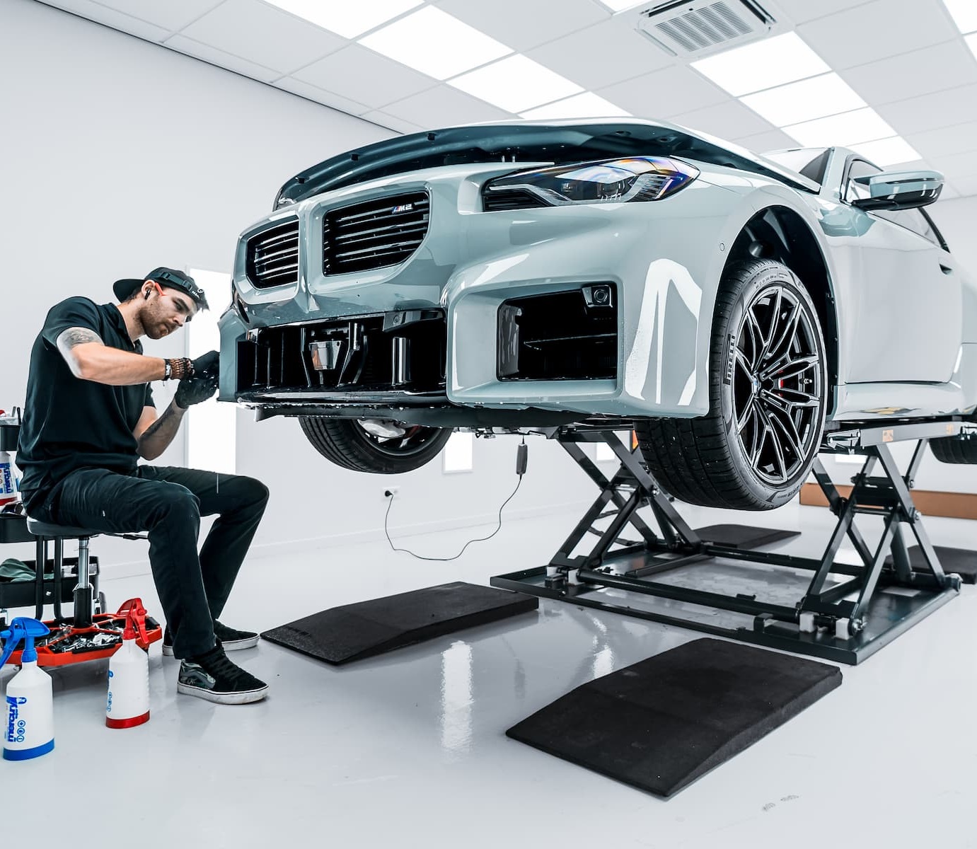 Specialist applies PPF film to a BMW