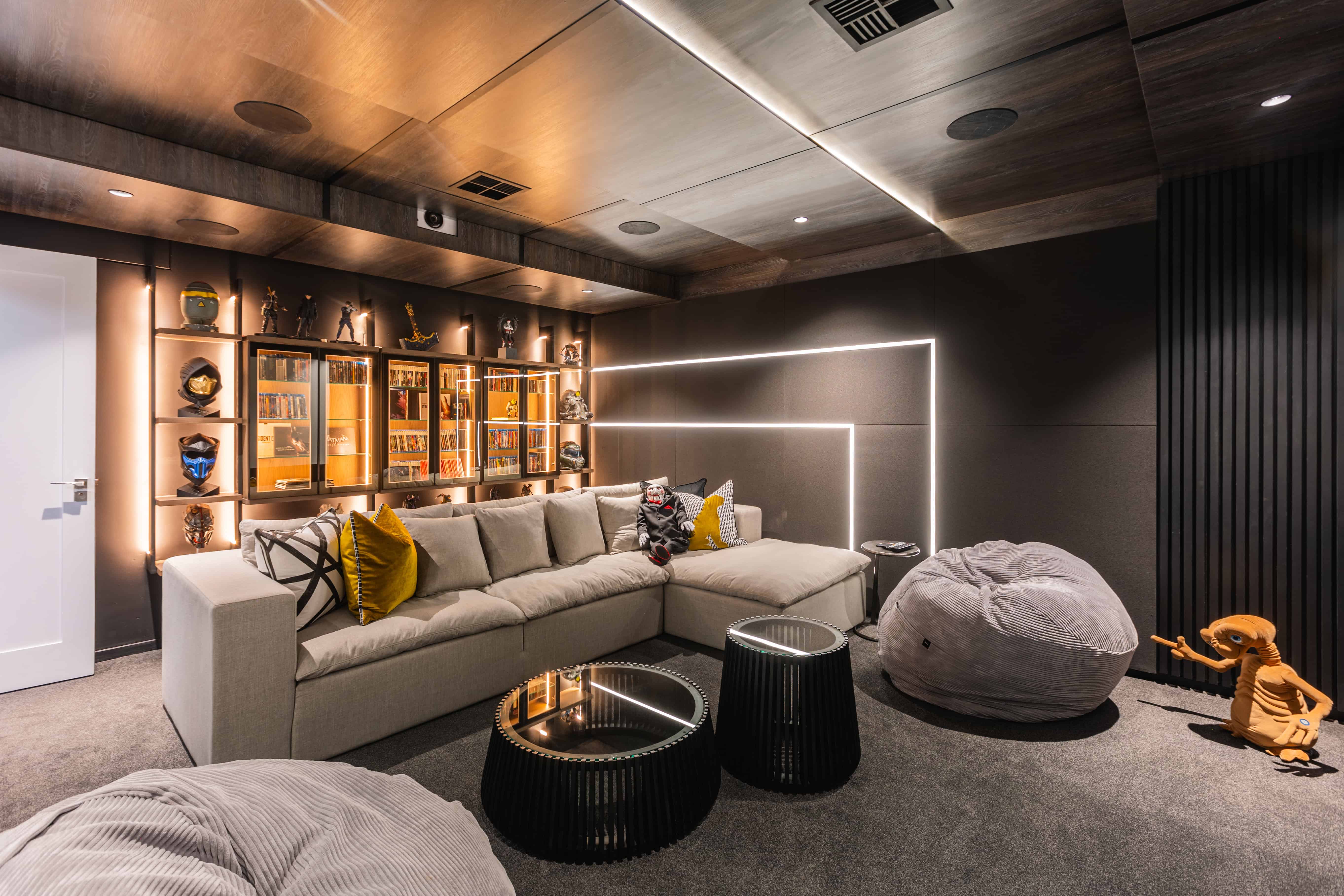Contemporary cinema room with layered lighting, Steyn City – Renovatio Interiors Johannesburg.