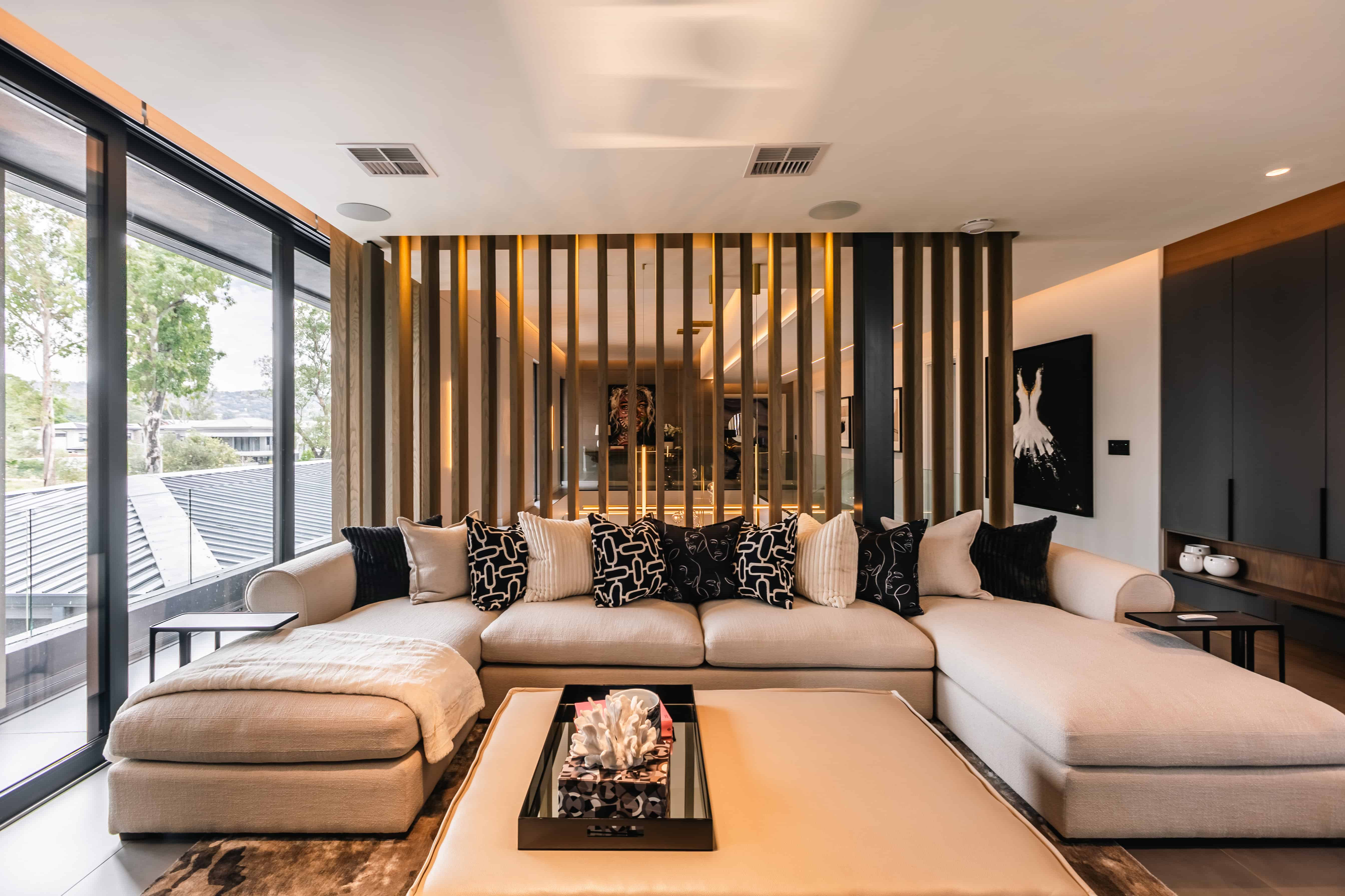 Tranquil contemporary pyjama lounge with neutral palette and soft daylight, Steyn City – Renovatio Interiors Johannesburg.