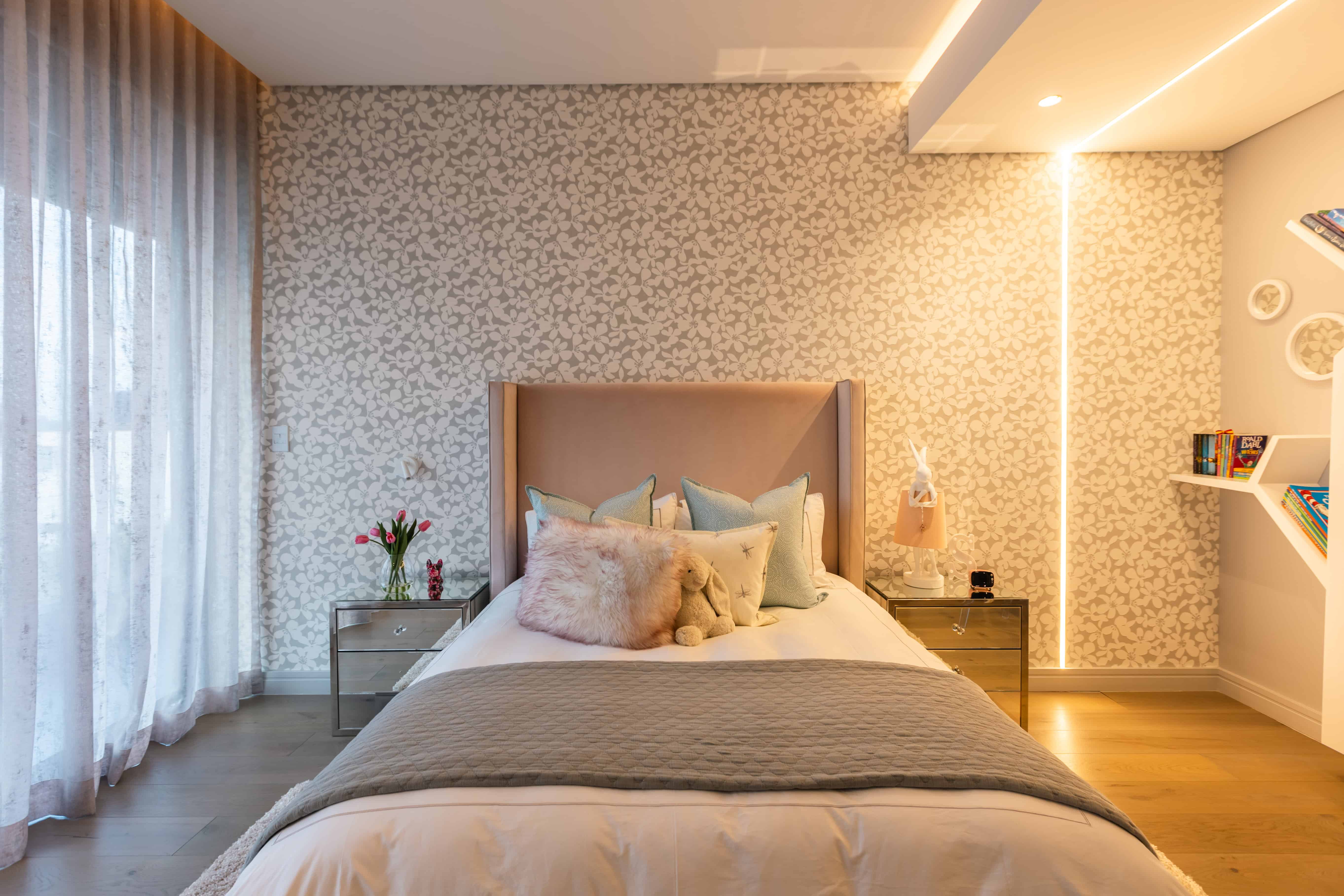 Child’s bedroom with soft pink accents and cozy layered bedding, Steyn City – Renovatio Interior Design Johannesburg.
