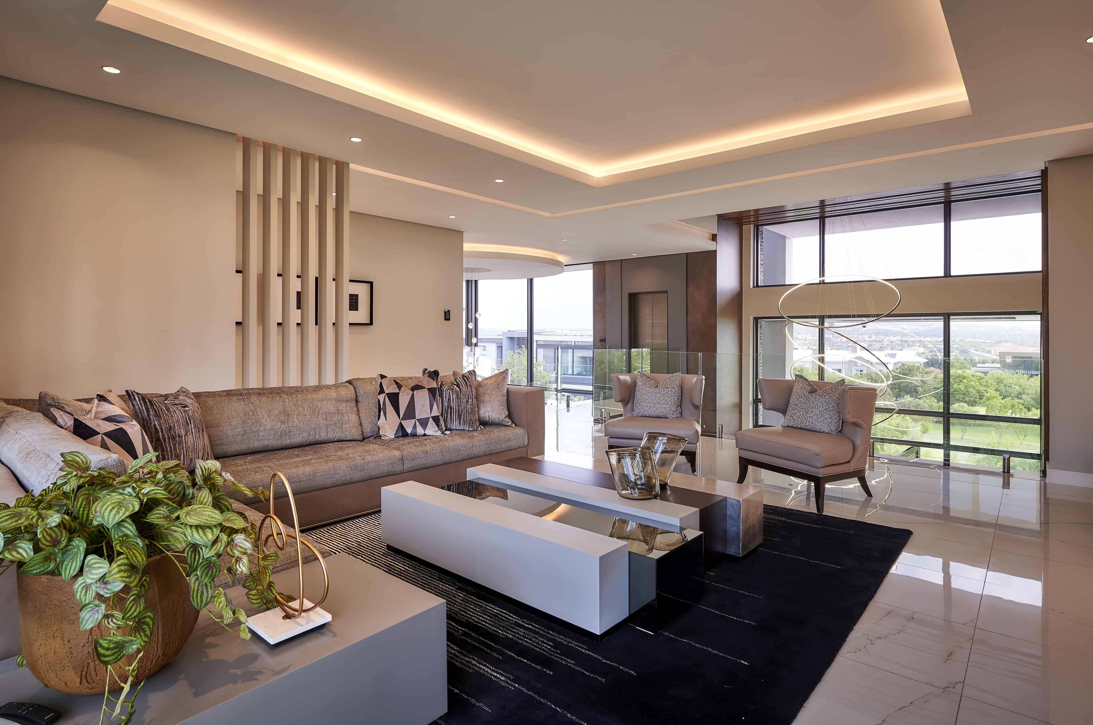 Chic living room with neutral palette and lush indoor plants styled by Interior Designer Johannesburg.