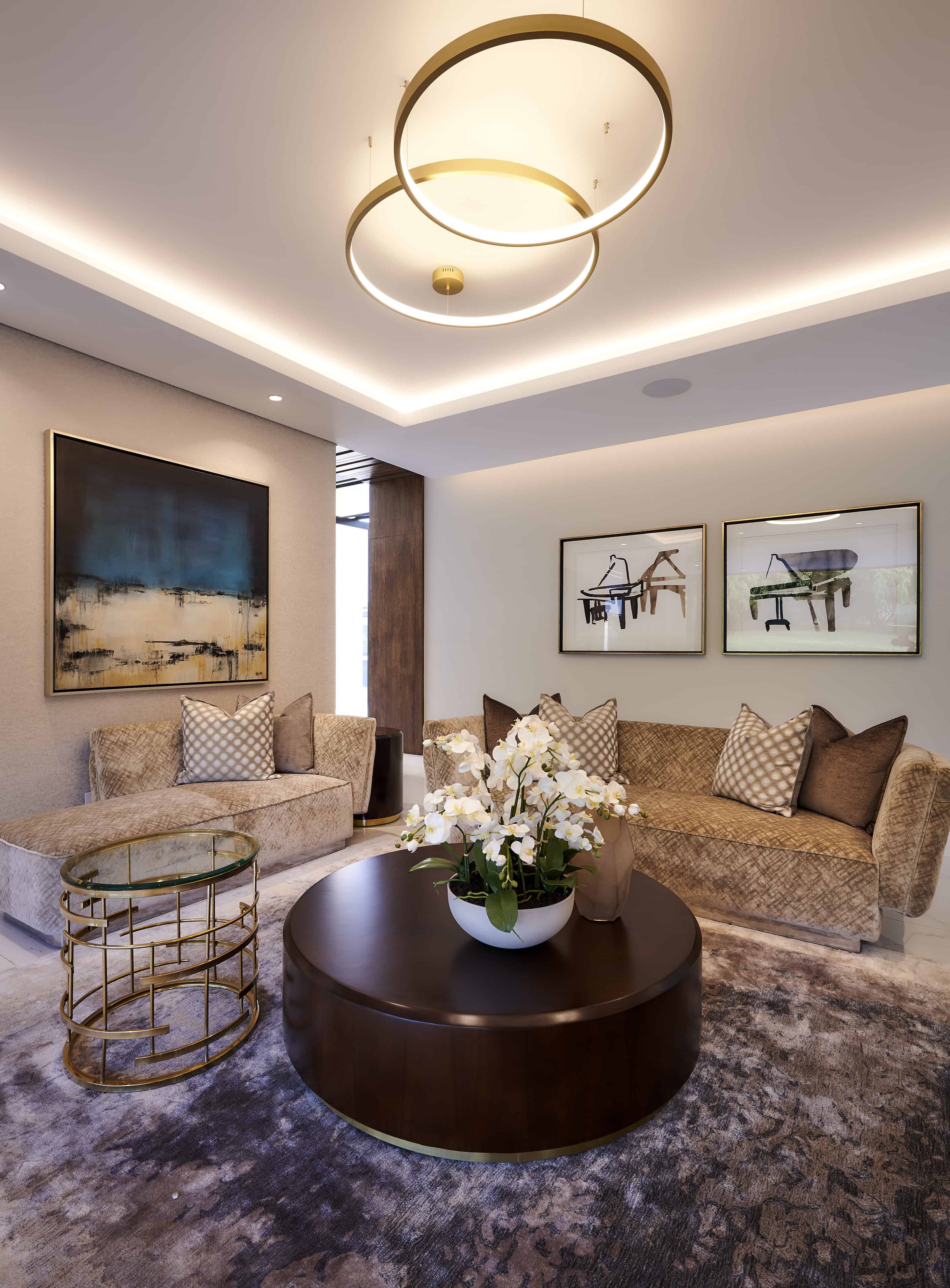 Modern open‑plan living and dining area with high ceilings designed by Interior Designer Johannesburg.