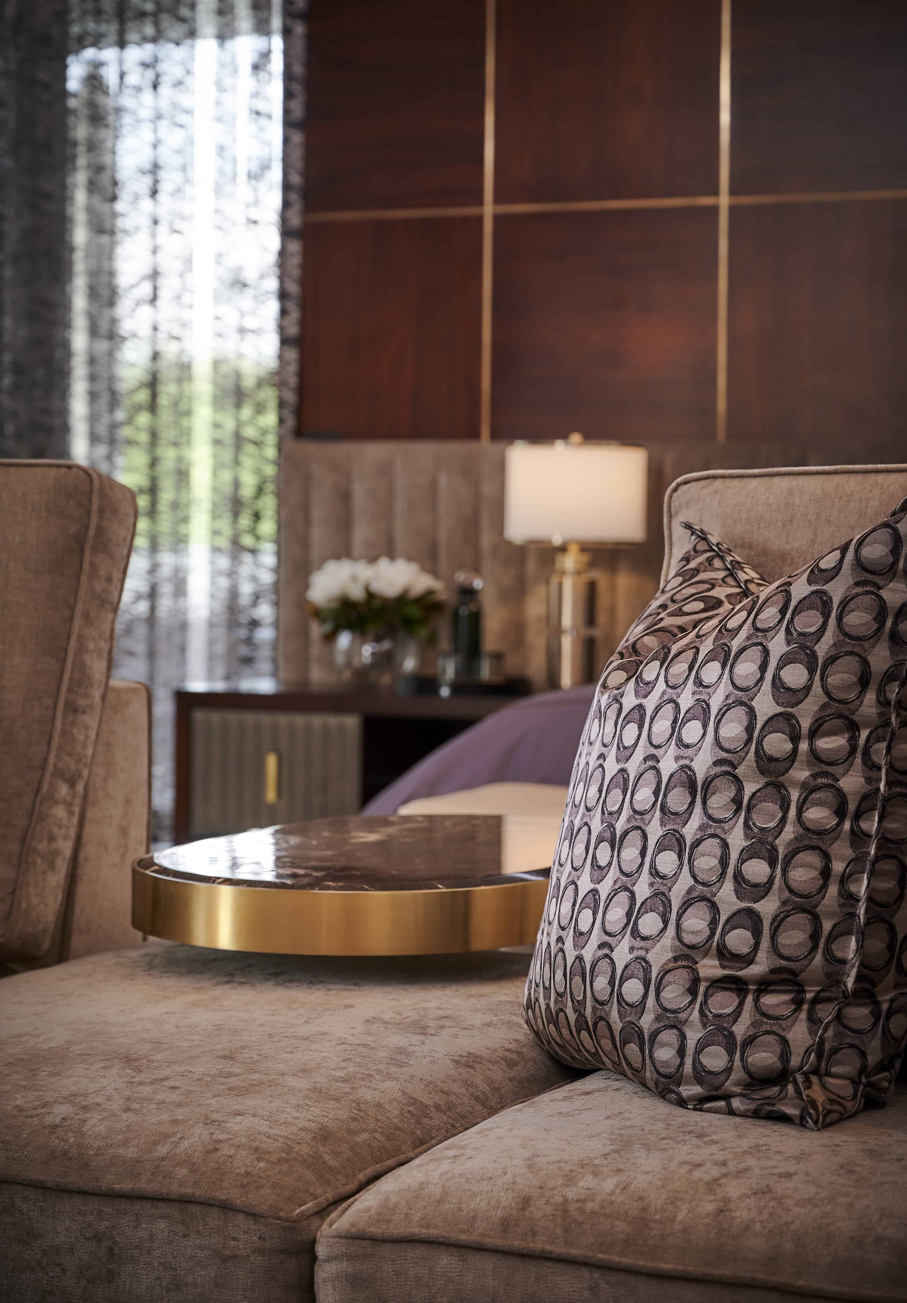 Stylish bedroom with textured accent wall and modern bed frame by Interior Designer Johannesburg.