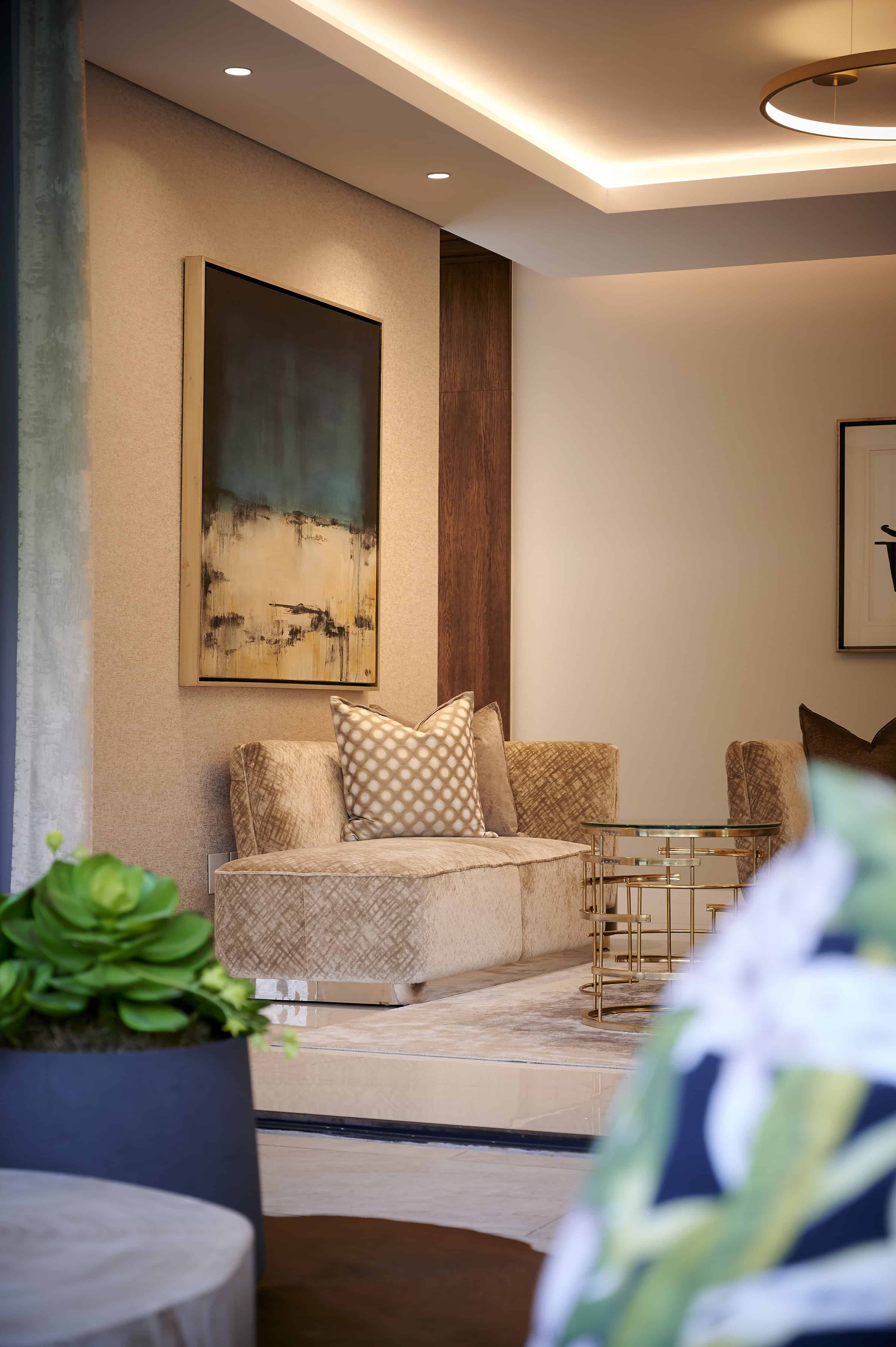 Contemporary lounge with accent wall and decorative elements styled by Interior Designer Johannesburg.