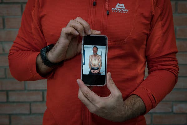 Rudd showing a picture of himself after an Antarctic expedition in 2012.