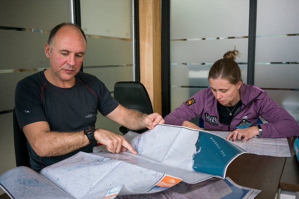 Rudd checking the planned route with his expedition manager, Wendy Searle.