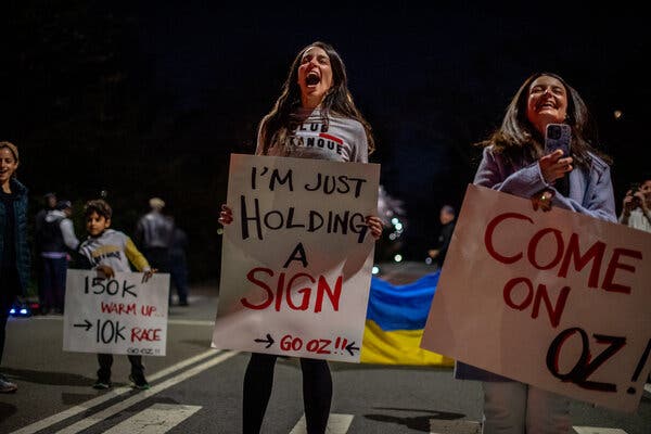 Elisa Rosen with fans and friends cheered her husband as he ran his record-breaking loop.
