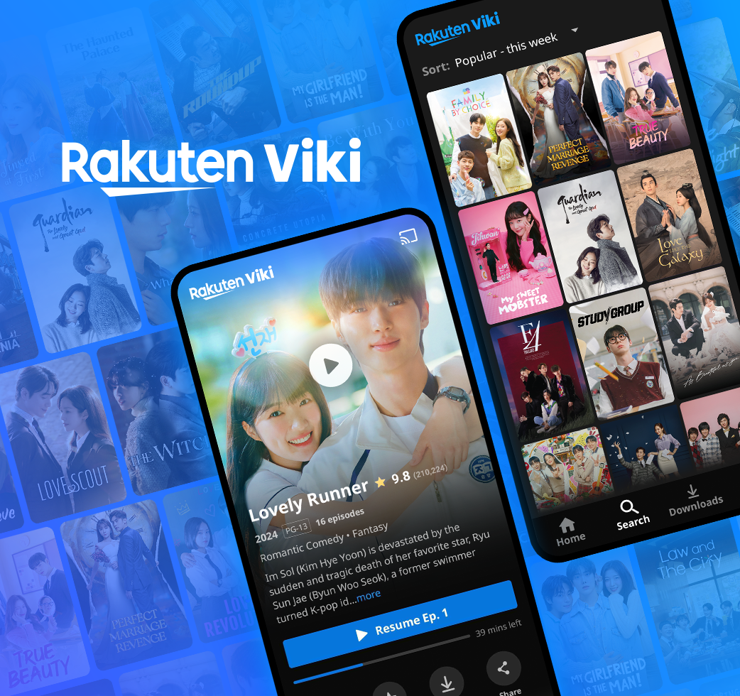 A woman smiling while holding a cup, dressed in a jacket and coat, standing on the sidewalk outdoors.