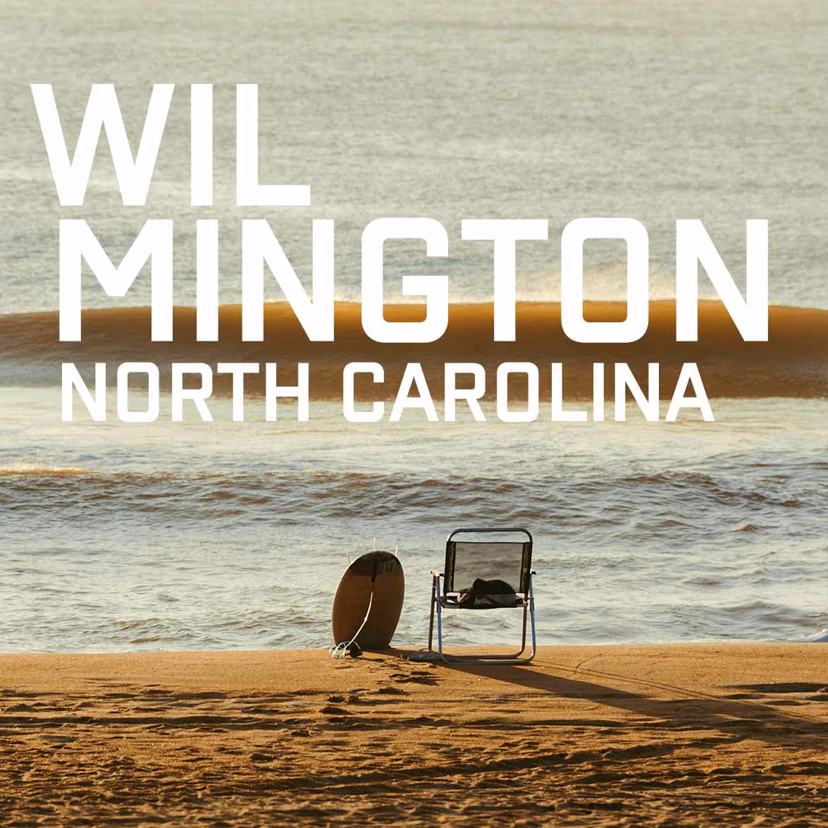 Chair and surfboard on a sandy beach with waves in the ocean at Wilmington, North Carolina.