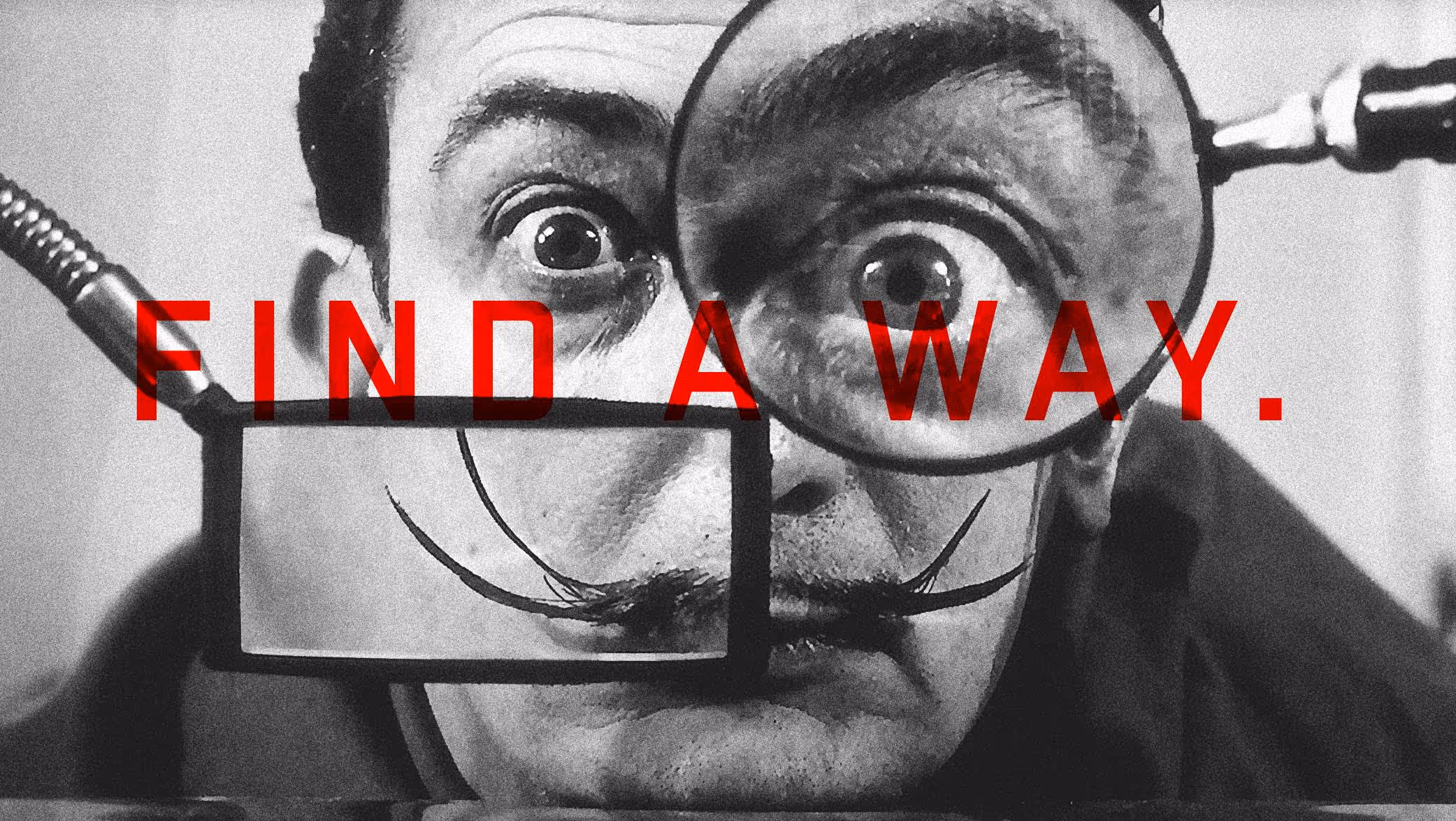 Black and white close-up of a man with a mustache holding two magnifying glasses, one enlarging his right eye and the other framing his mustache, with red text overlay reading 'FIND A WAY.'