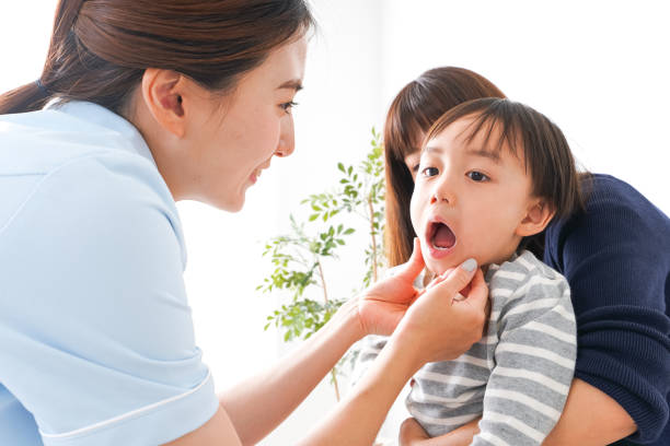 Dentist and Child Dentist and Child dental consultation kids stock pictures, royalty-free photos & images