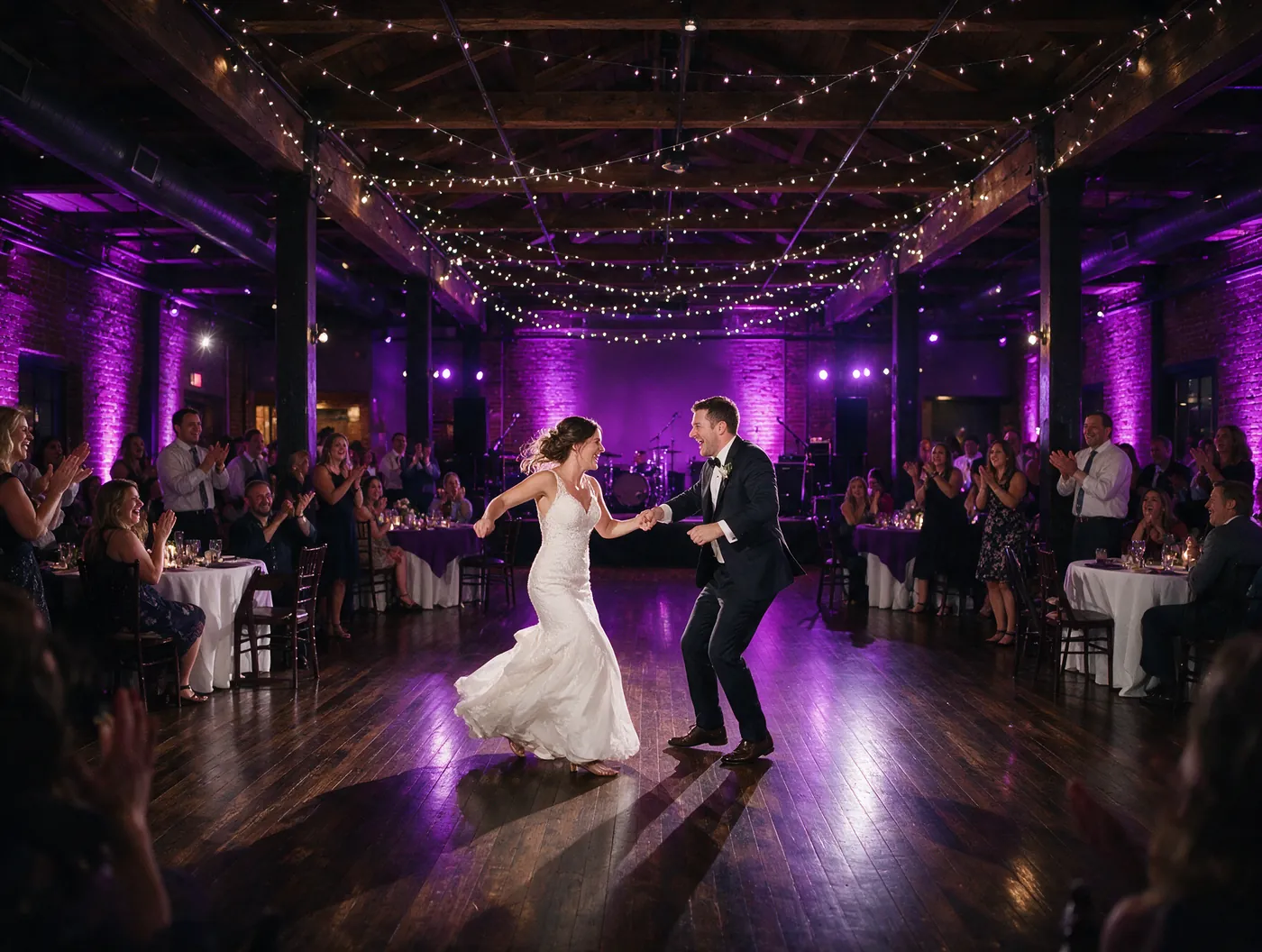 Couple dancing at a wedding reception in a music venue
