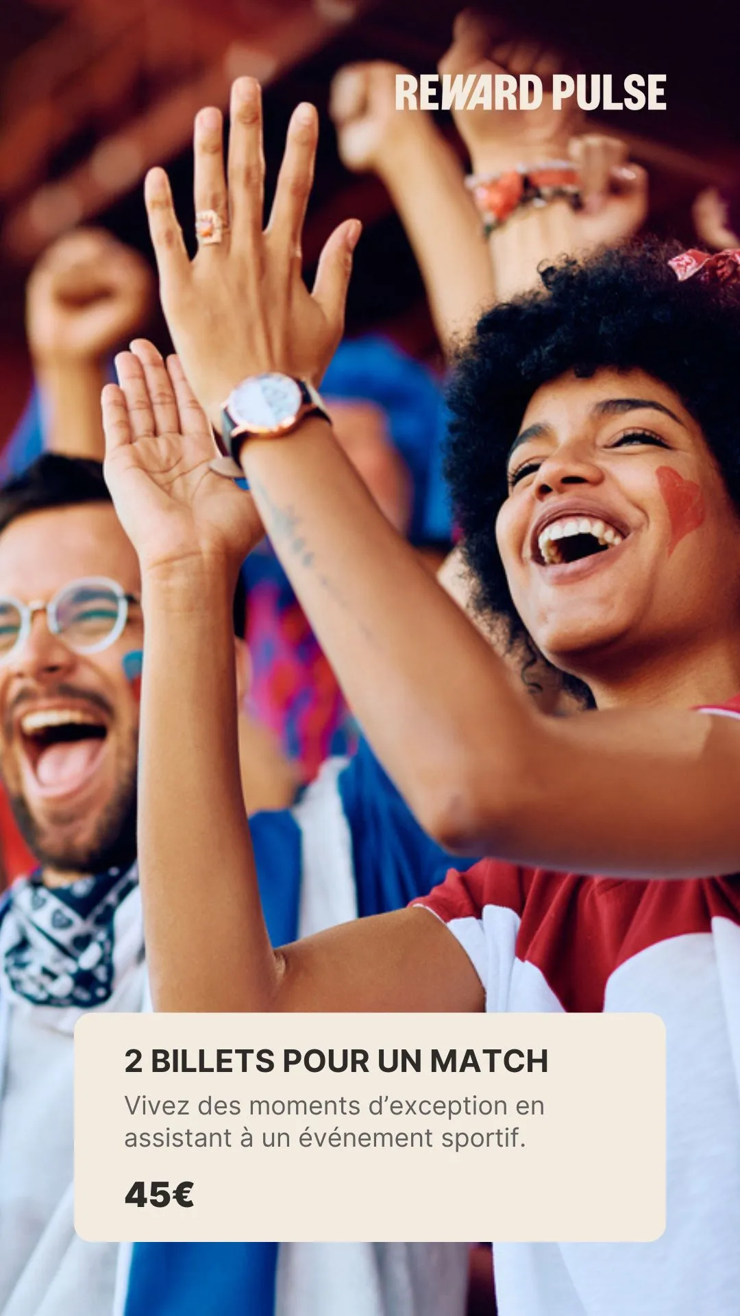 Excited sports fans cheering with raised hands, face paint, and smiling widely at an event.