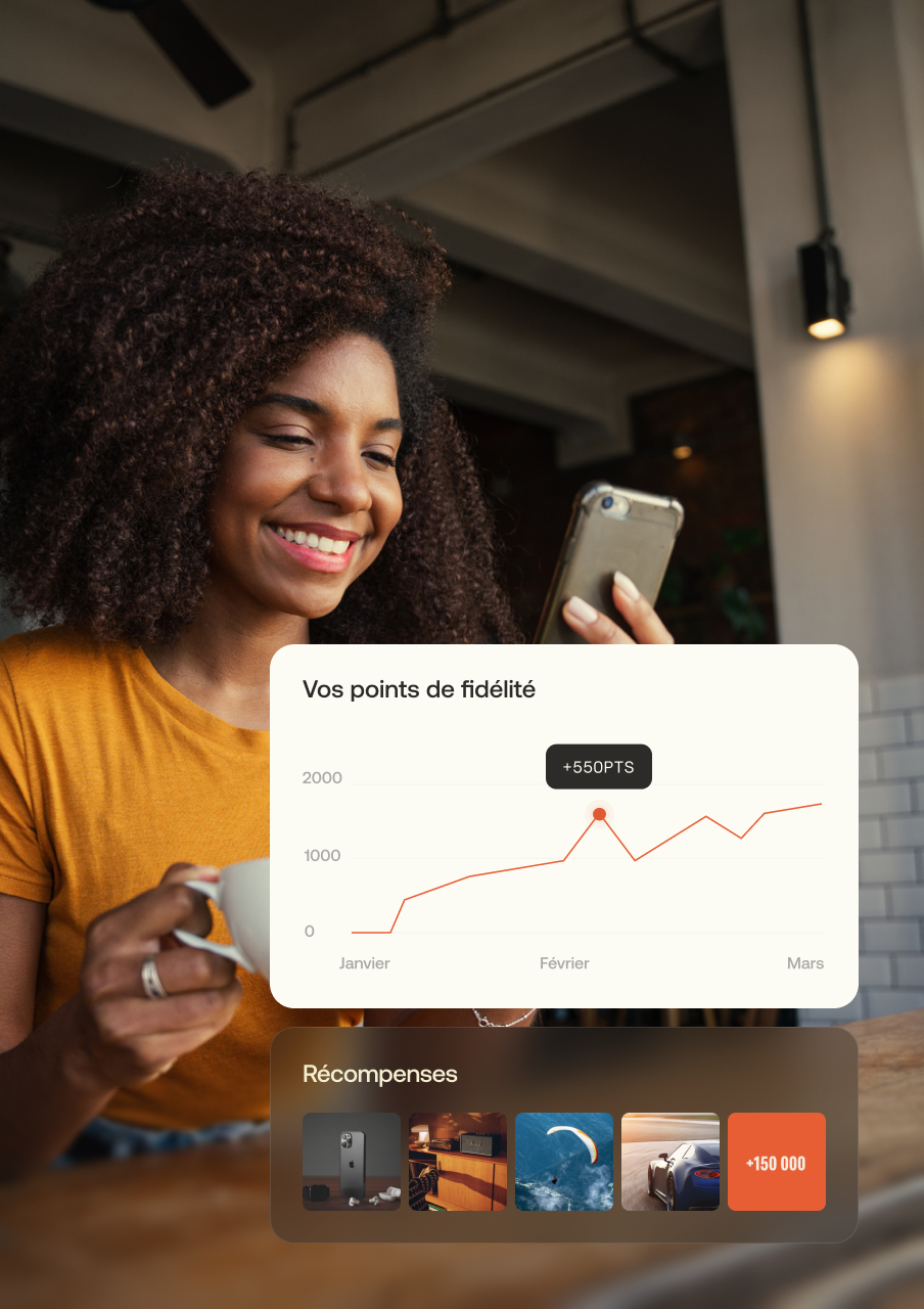 Smiling woman with curly hair holding a phone and cup, showing a loyalty points graph and reward options on screen.