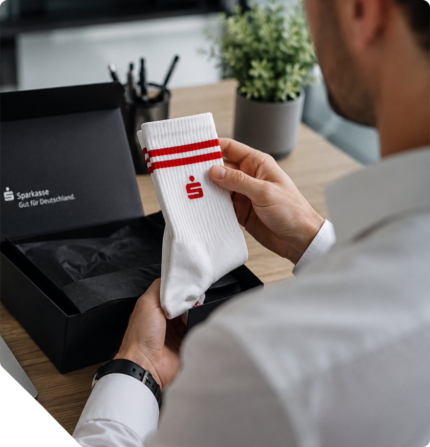 Socks with Sparkasse logo as an employee gift