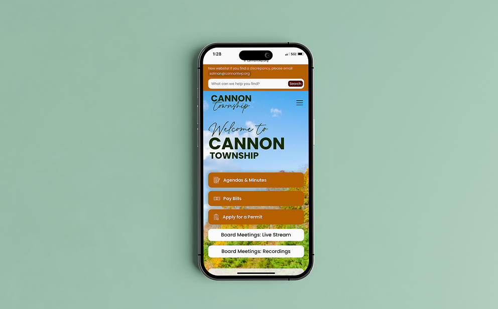 Mobile phone screen showing Cannon Township website homepage with menu options for agendas and minutes, pay bills, and apply for a permit.