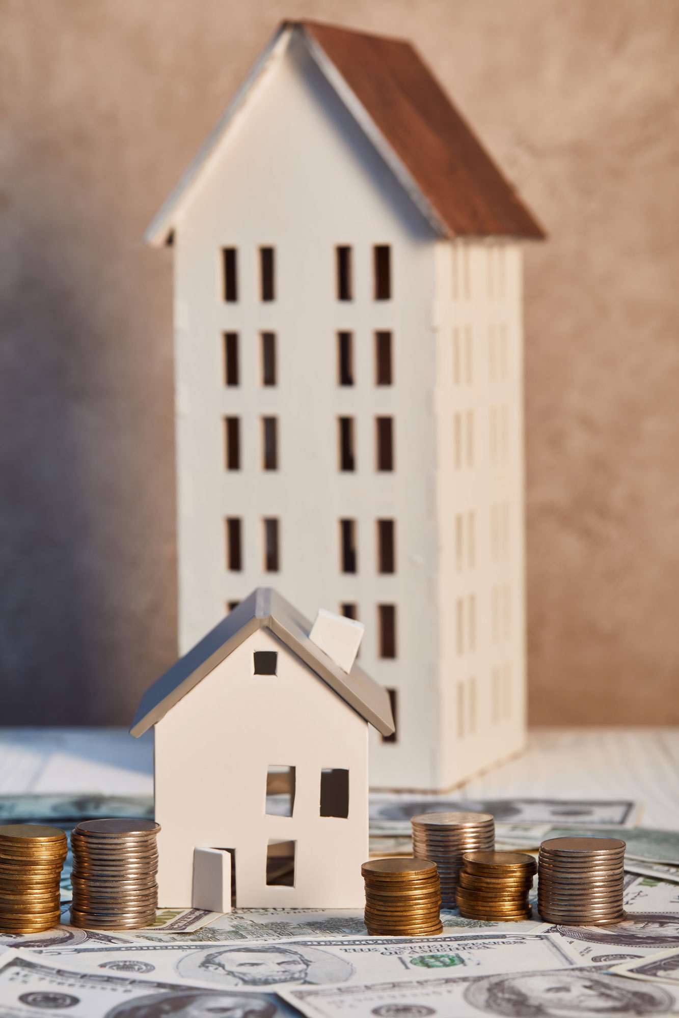 Two model homes one smaller in front of the other. 