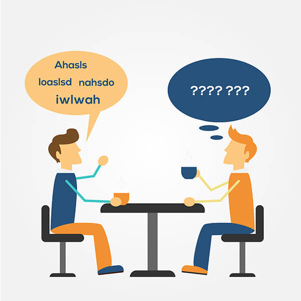 Group of engineering graduates in discussion around a table
