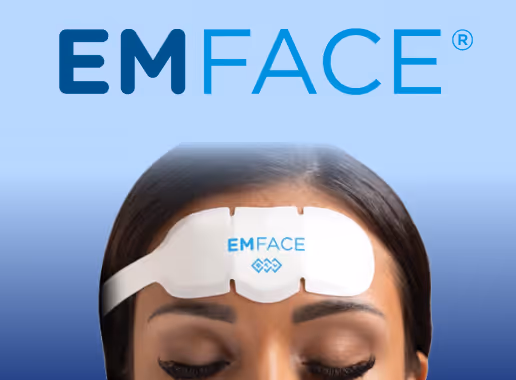 Close-up of a woman wearing an EMFACE device on her forehead against a blue gradient background.