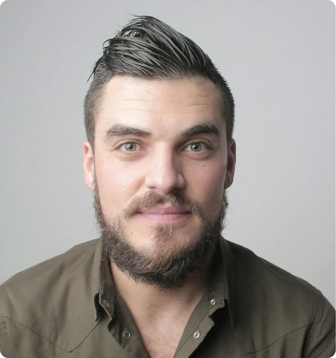 A close up of a person with a beard
