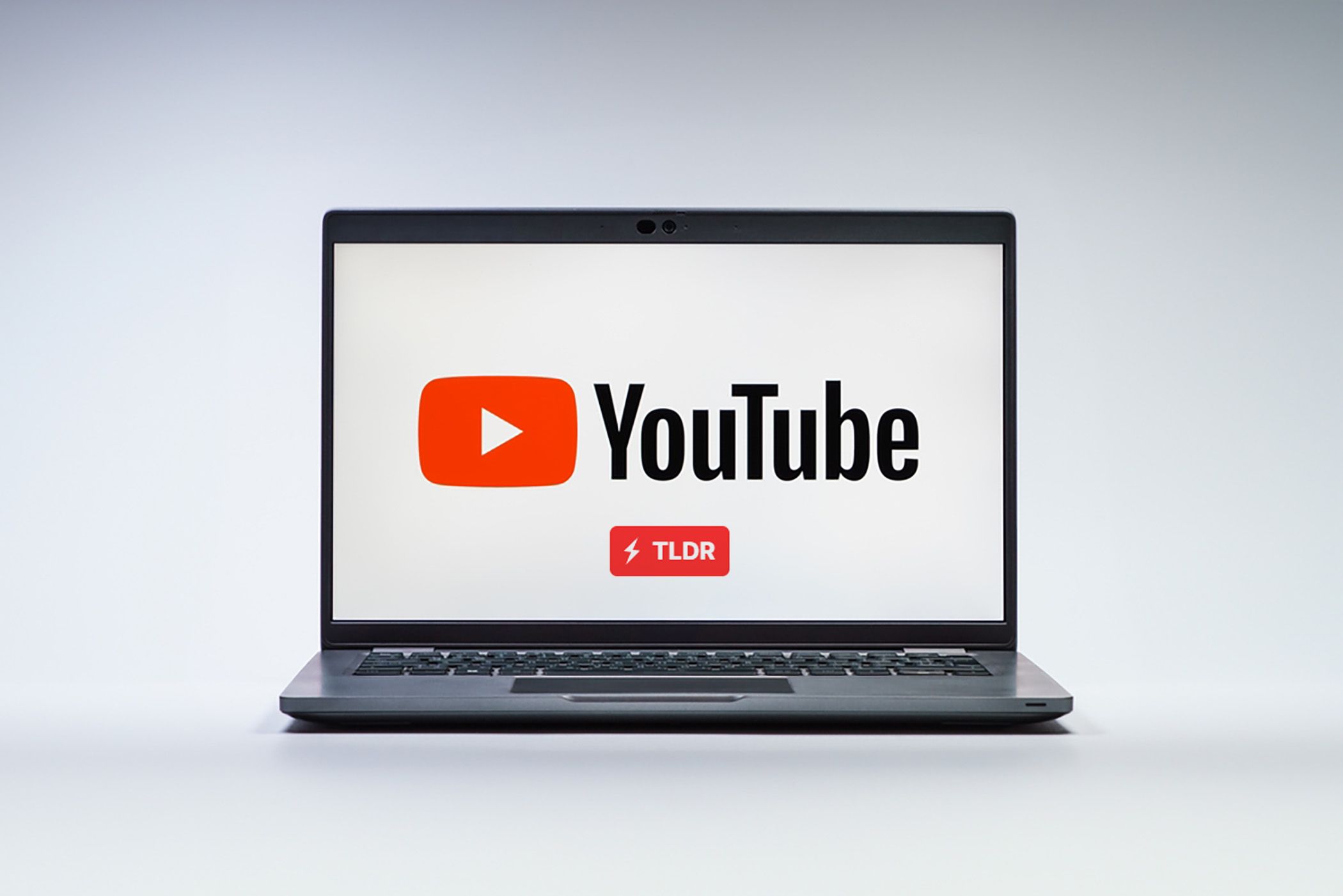 YouTube logo on a laptop with TLDR logo underneath