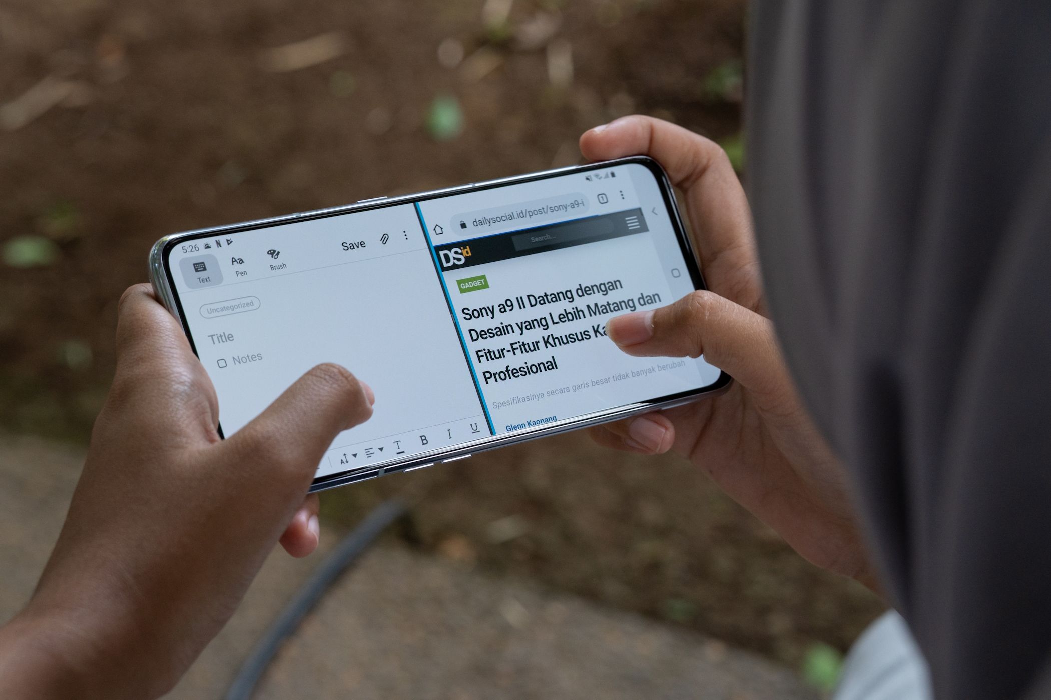 Person using split screen view on Galaxy phone
