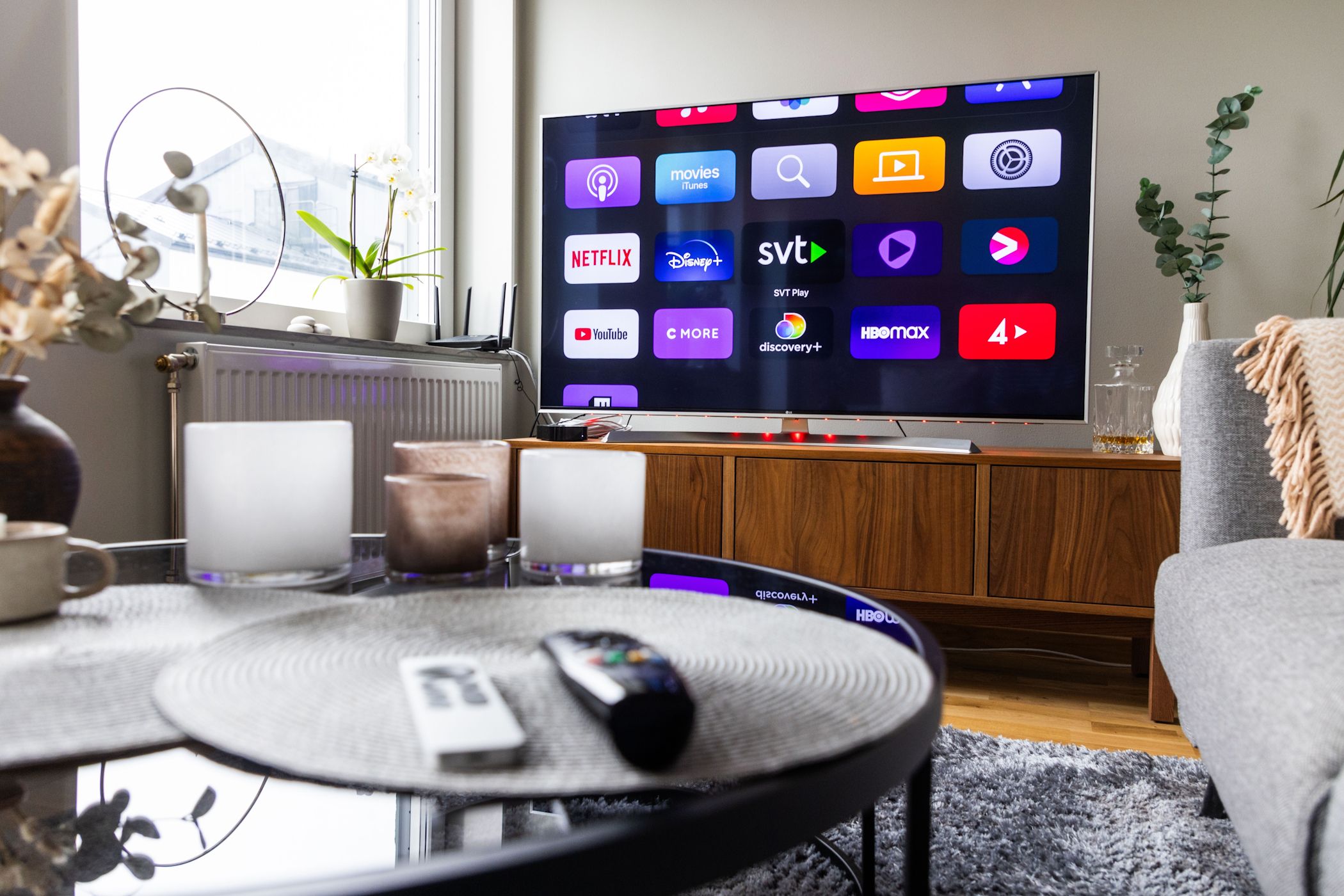 A smart TV displaying various app icons on its home screen.