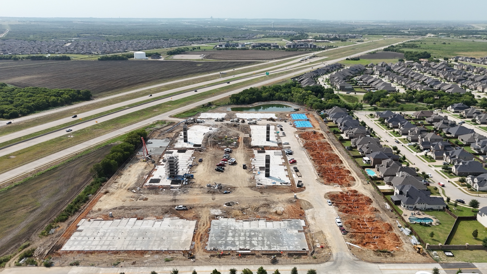 Langmore concrete construction with PT foundations, paving, and off-site roadwork in Mansfield, TX