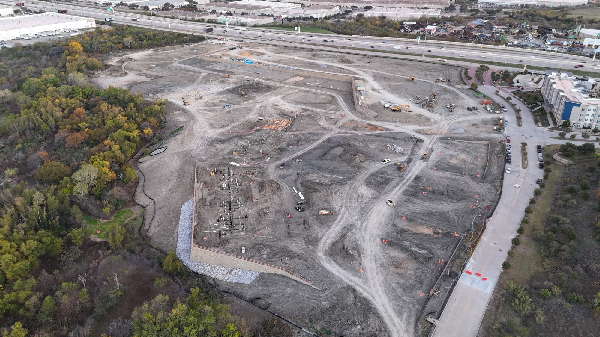 PT foundations across multiple building types, poured and curing. The scale of the Canyon Apartments site footprint starts to show.