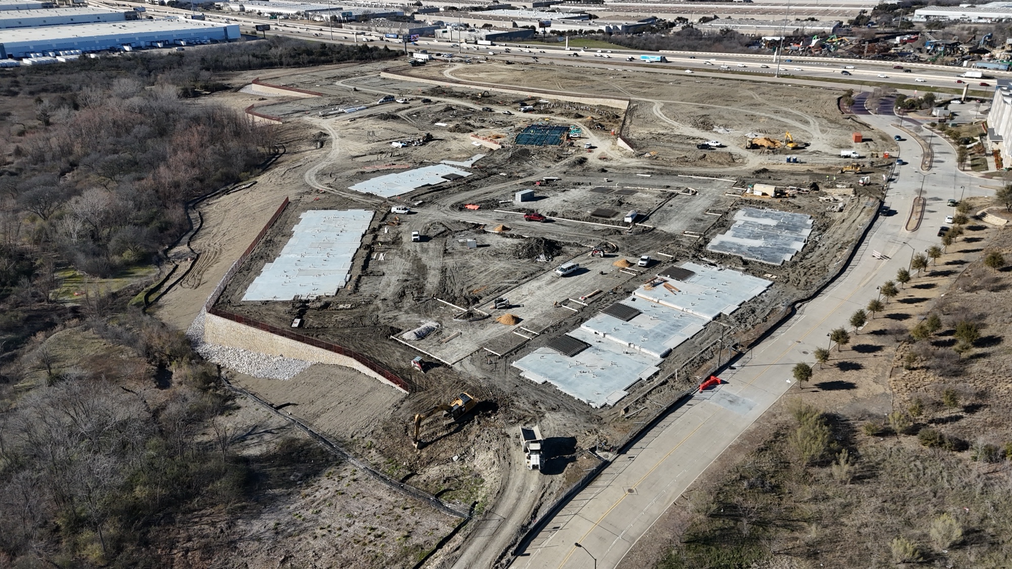 Foundations down, framing starting. Canyon Apartments moving through phases with multiple buildings in progress simultaneously.