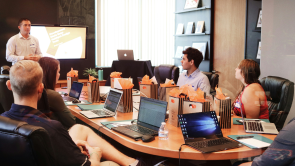 A meeting room full of people