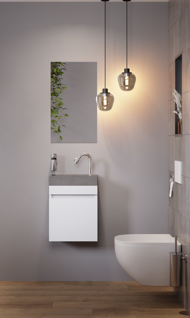 Wit wandcloset met een wit fonteinmeubel en een hanglamp