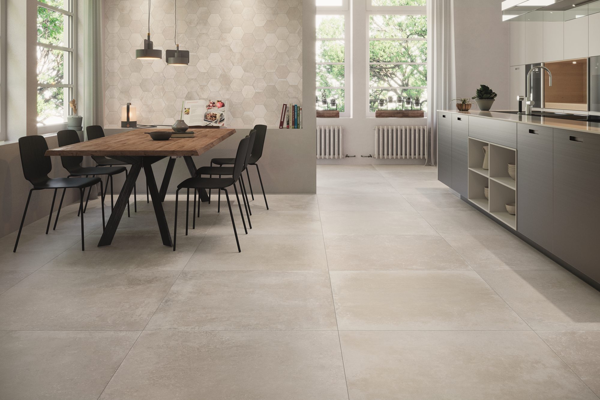 Open keuken met eethoek op een cremekleurige betonlookvloer in groot formaat