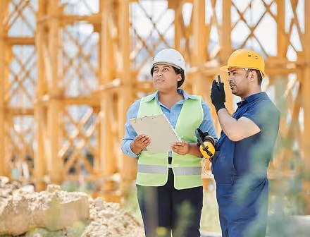 Builders talking on construction site