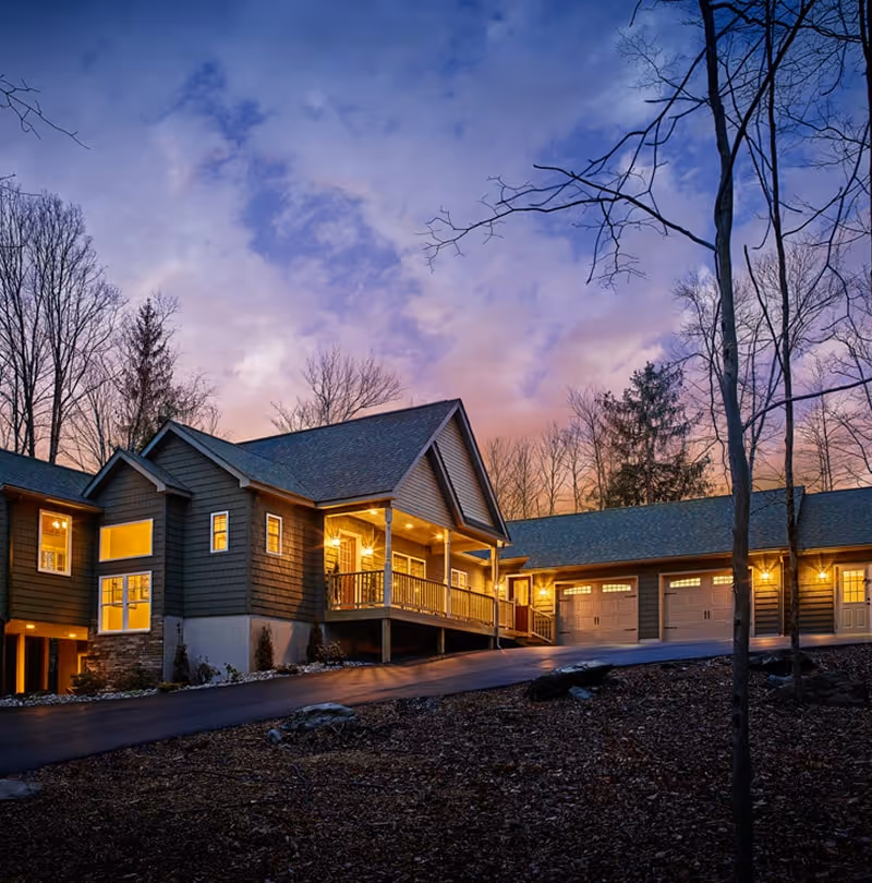 Ranch house with cozy lights at night