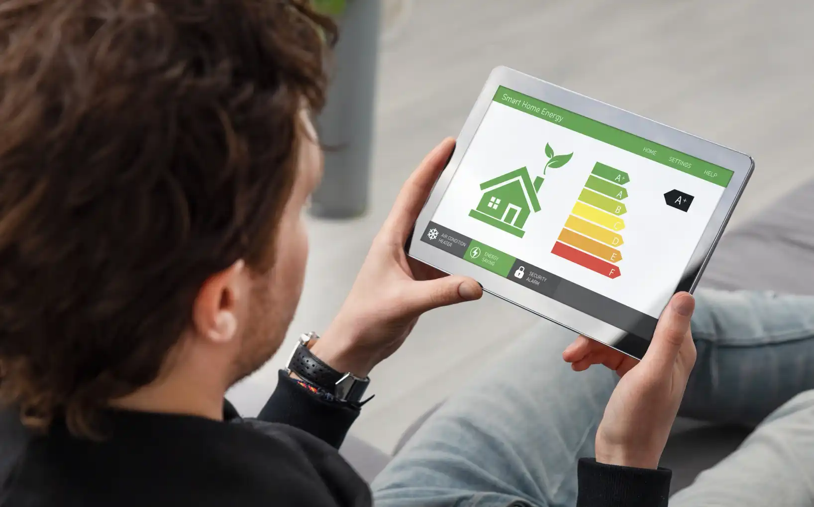 A smart home energy efficiency app displayed on a tablet screen showing an A+ energy rating. 