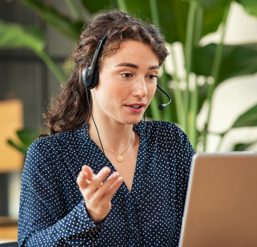 A customer support representative engaging in a detailed discussion with a customer, attentively addressing their situation and needs.