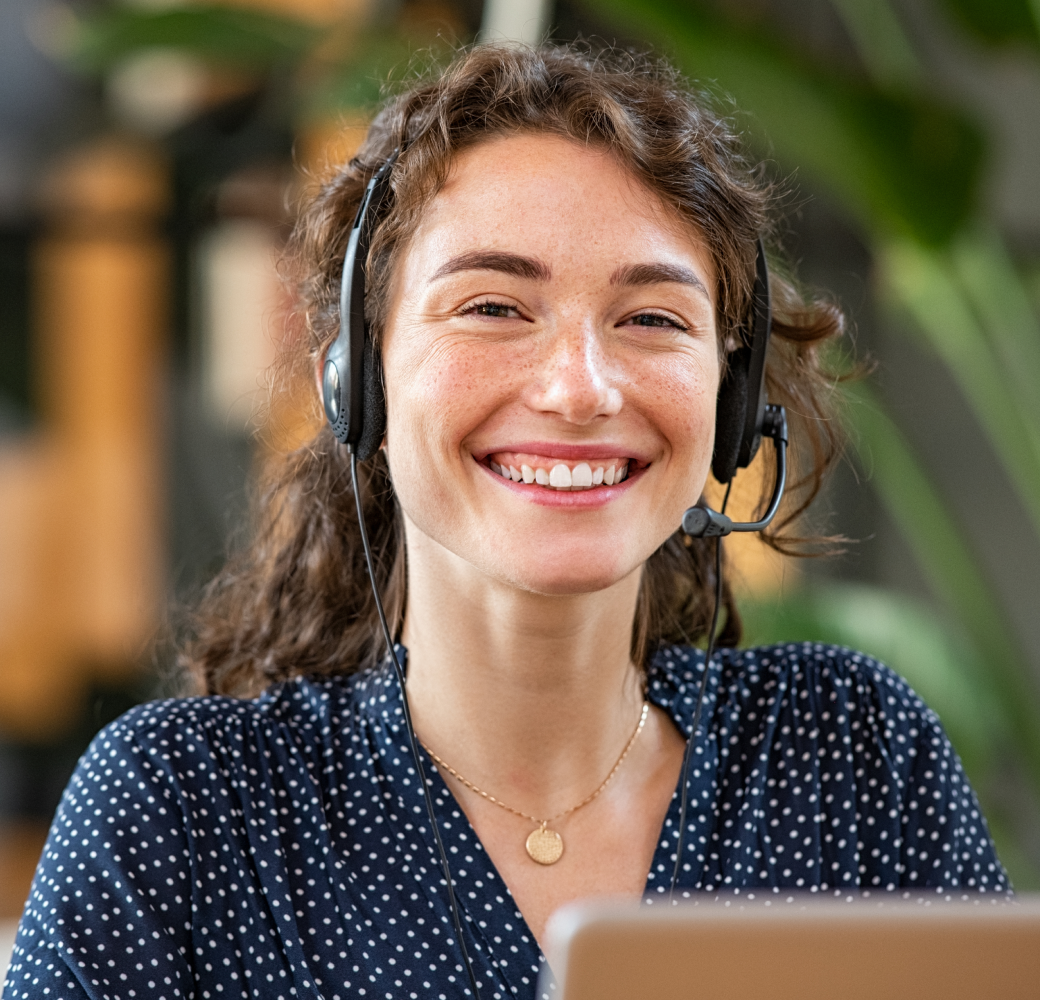 An eager and supportive young customer support professional, equipped with a headset, ready and attentive to assist callers facing financial difficulties.