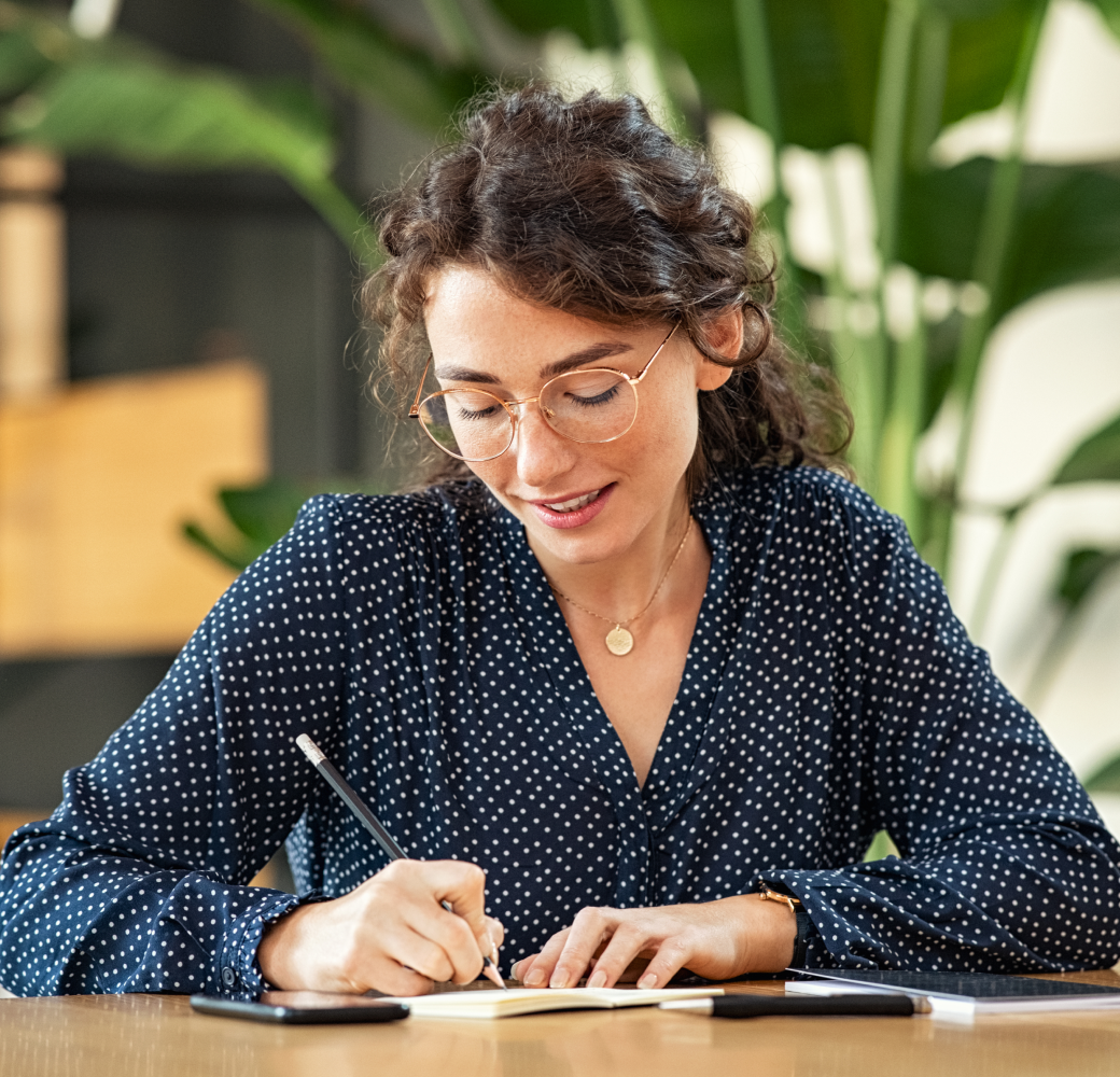 The support representative carefully notes down essential details about the customer's preferred next steps regarding their loan.