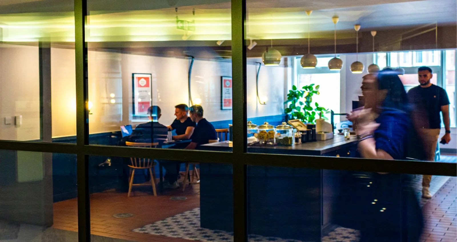 Team of Tandem employees collaborating in a meeting.