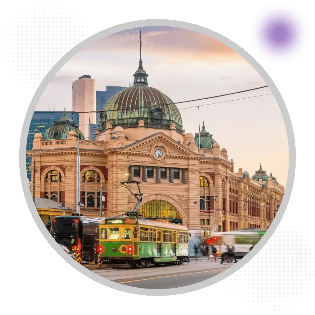 Melbourne Flinders Street Station with iconic yellow and green tram in central business district