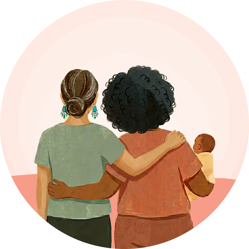 Two women embracing, one with a baby, viewed from the back within a circular frame.
