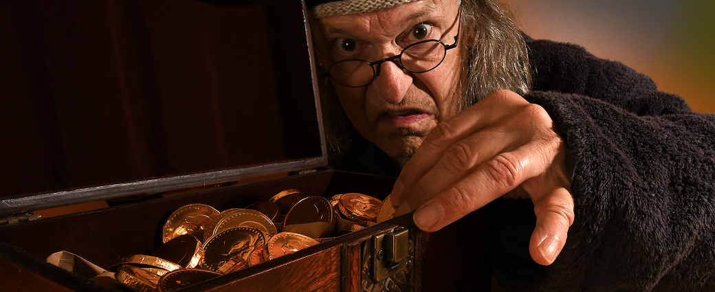Scrooge is counting his money chest.