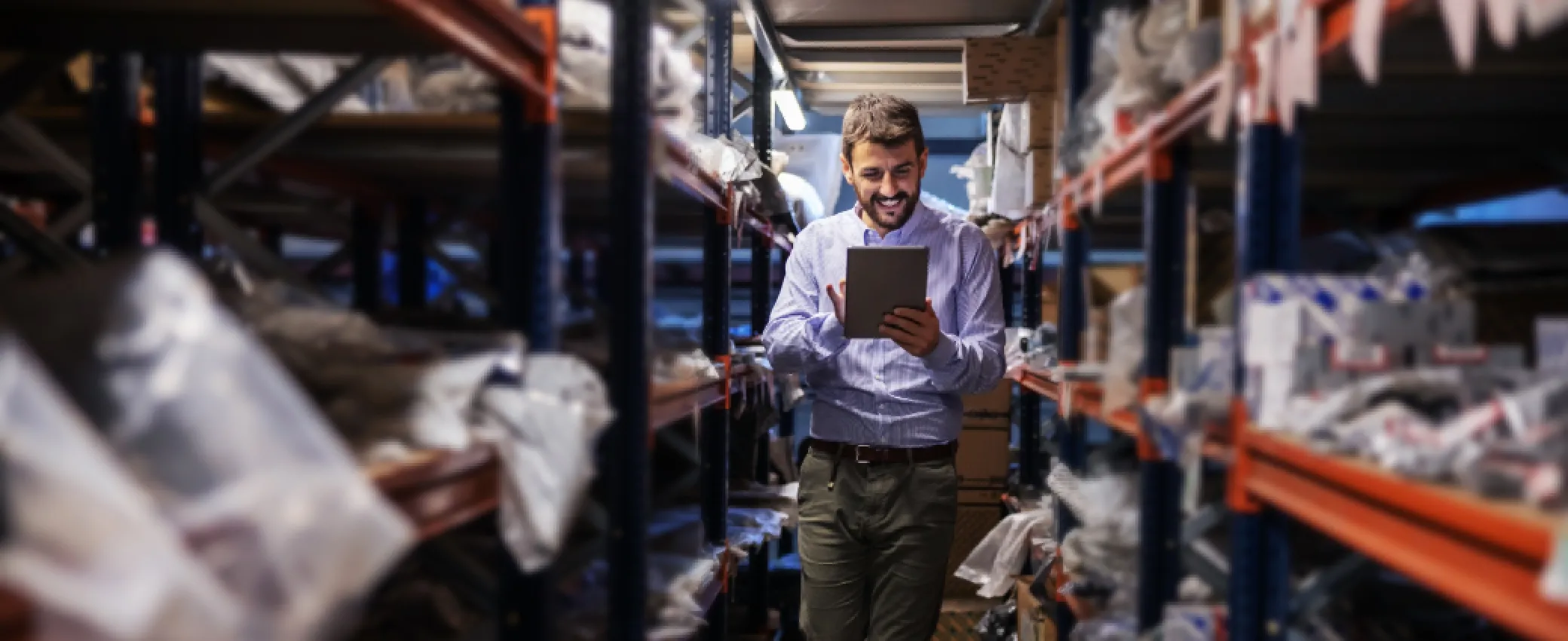 Warehouse manager reviewing returns program