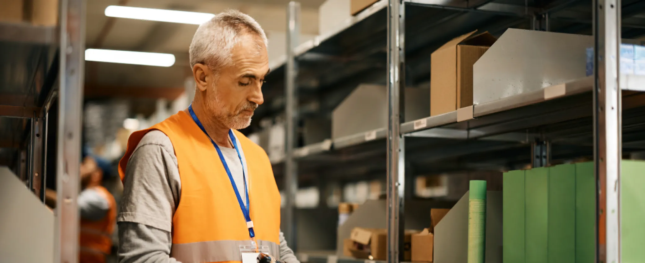 Warehouse associate scanning a returned package