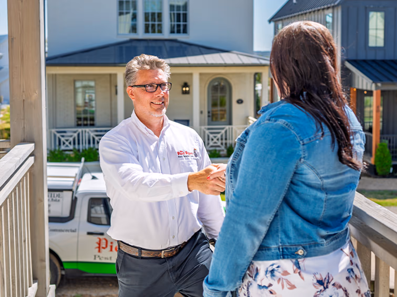 pest control technician greeting a customer