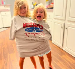 Two children playing | Courson Heating & Cooling
