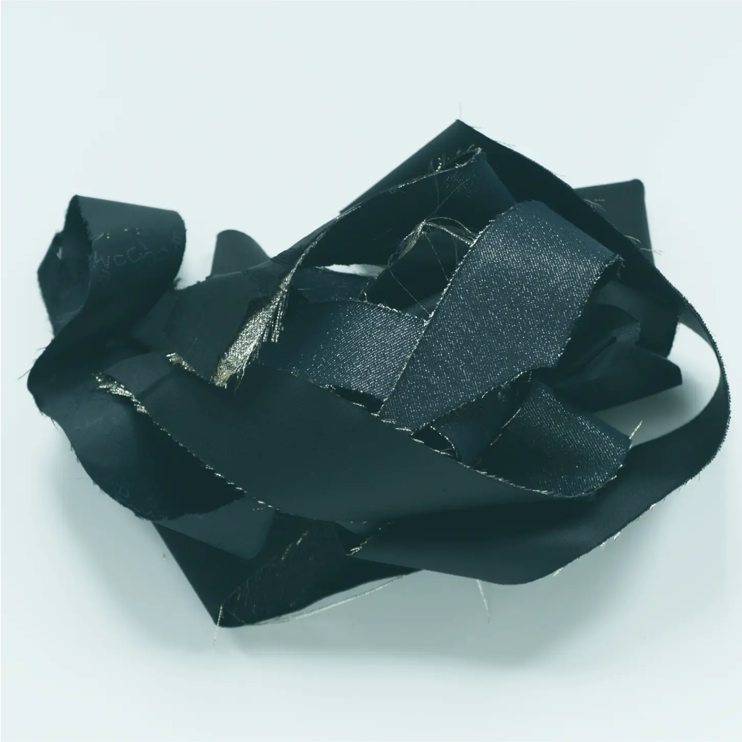 a black ribbon on a white surface