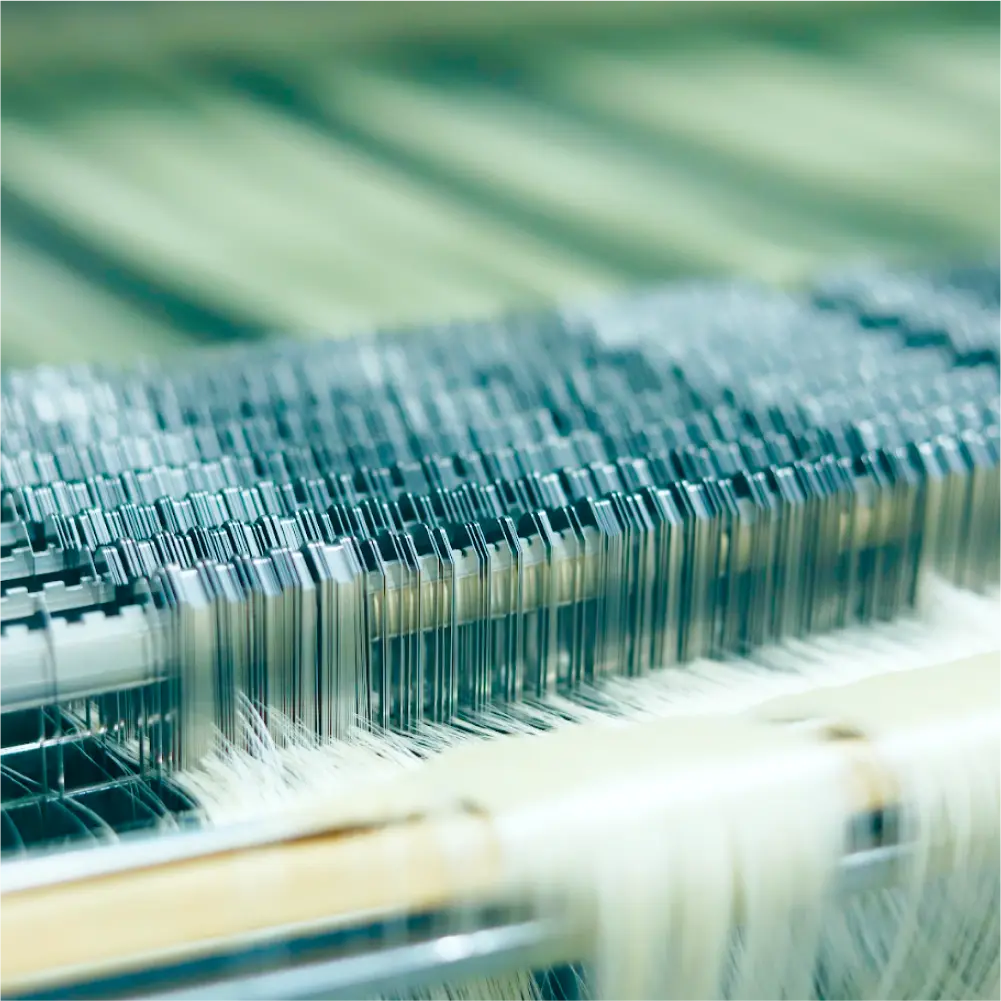 a machine with white threads